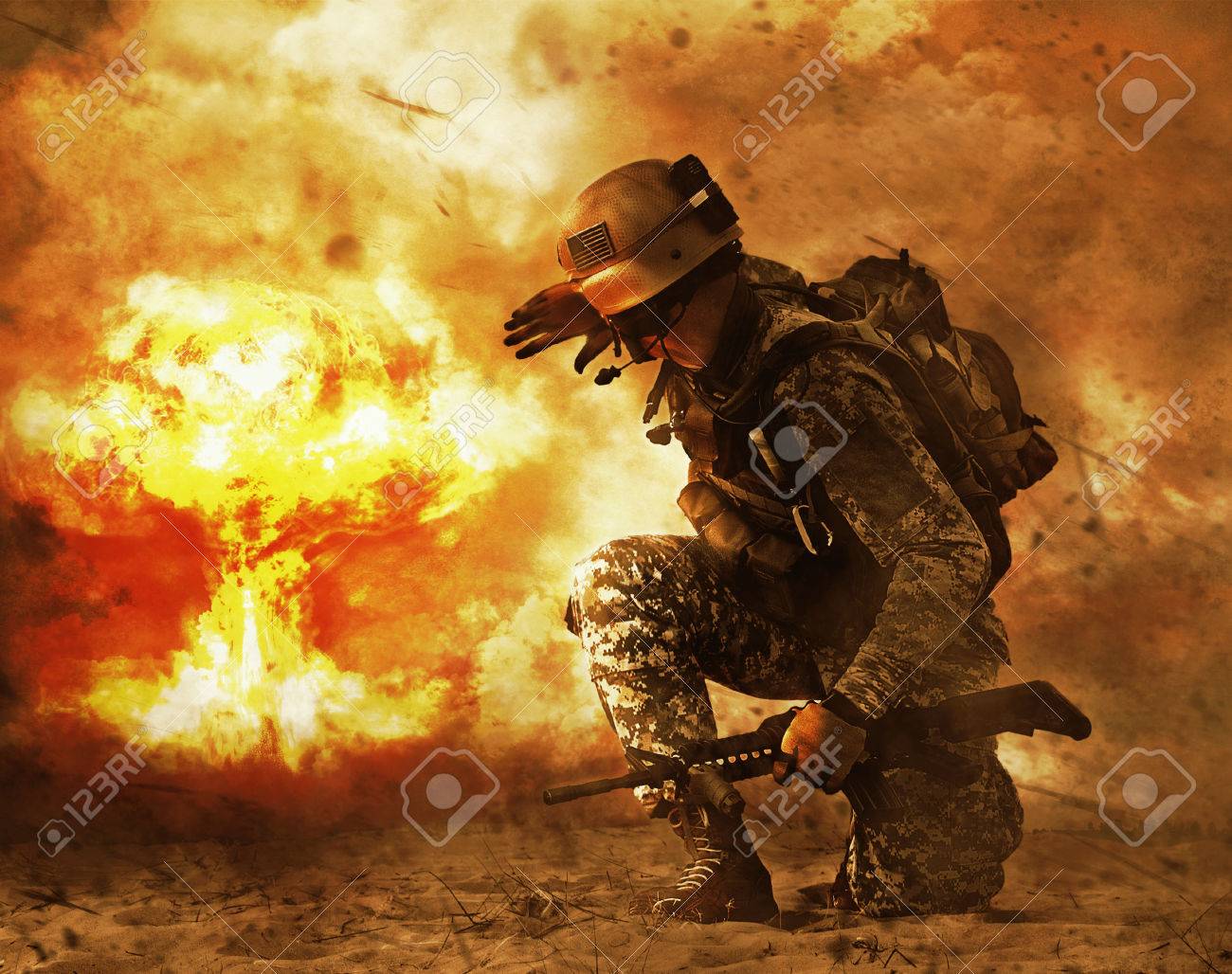 US soldier in the desert during the military operation turning to nuclear explosion mushroom cloud covering his eyes. He is doomed - 69805678 US soldier in the desert during the military operation turning to nuclear explosion mushroom cloud covering his eyes. He is doomed - 69805678