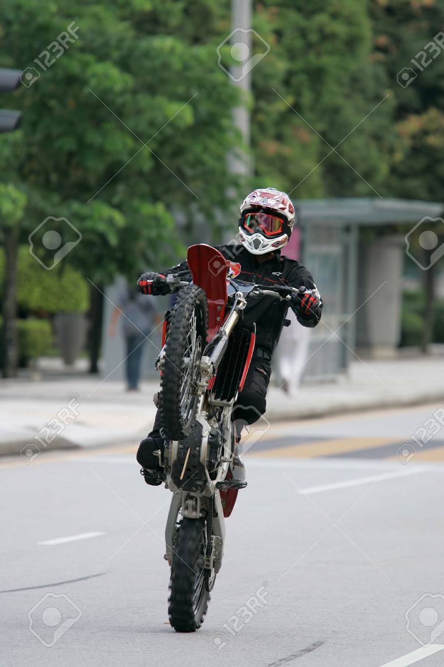 Putrajaya Malaysia Feb 25 Unidentified Member Of Army Red Warrior From Malaysia Armed Forces Performs Stunt Using Motorcycle During The Putrajaya Wow Carnival On Feb 25 2012 In Putrajaya Malaysia Stock Photo Picture