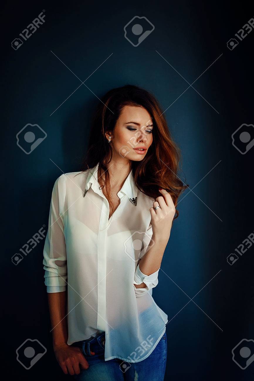 Beautiful Girl Standing Near The Dark Blue Wall In Darkness In Blue Jeans And White Shirt Stock Photo Picture And Royalty Free Image Image Beautiful Girl Standing Near The Dark Blue Wall In Darkness In Blue Jeans And White Shirt Stock Photo Picture And Royalty Free Image Image