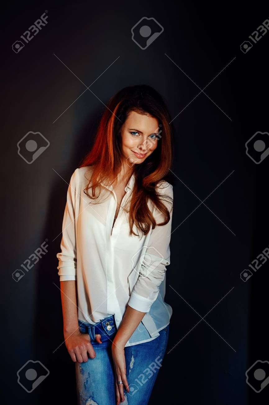 Beautiful Girl Standing Near The Dark Blue Wall In Darkness In Blue Jeans And White Shirt Stock Photo Picture And Royalty Free Image Image Beautiful Girl Standing Near The Dark Blue Wall In Darkness In Blue Jeans And White Shirt Stock Photo Picture And Royalty Free Image Image