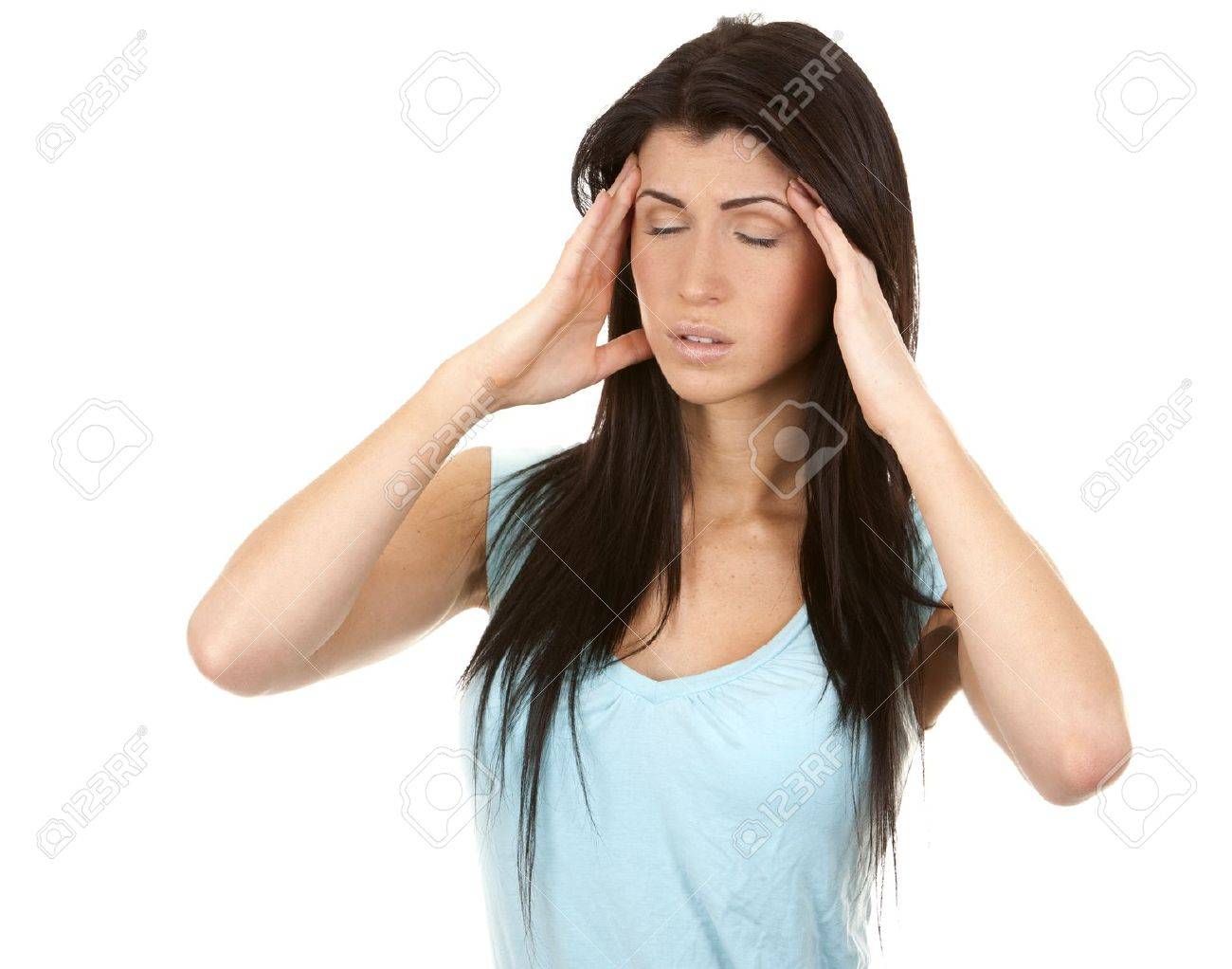 brunette having a headache on white isolated background - 16684429 brunette having a headache on white isolated background - 16684429