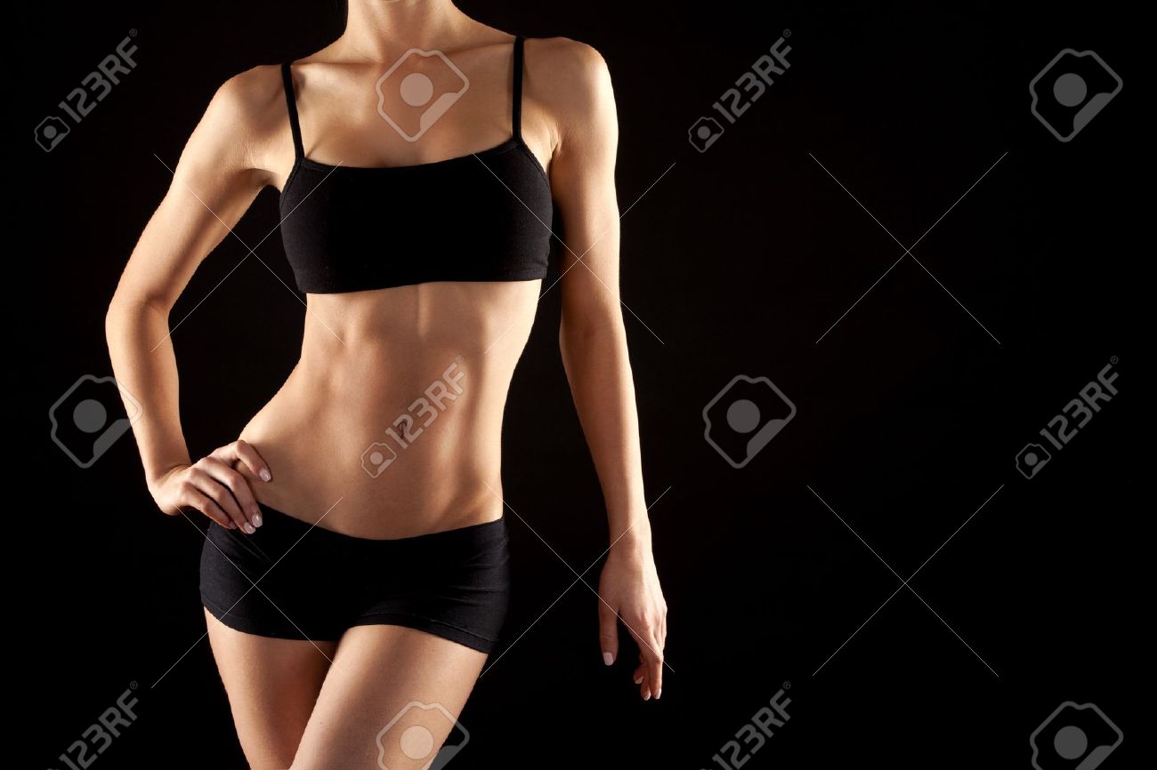 female fitness model posing on black background - 19062294 female fitness model posing on black background - 19062294
