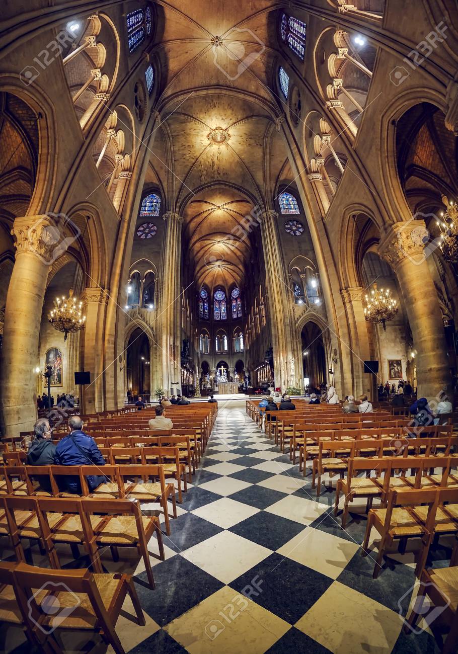 Undefined People Visitors Pray Sitting Inside Notre Dame Church Stock Photo Picture And Royalty Free Image Image 111315827