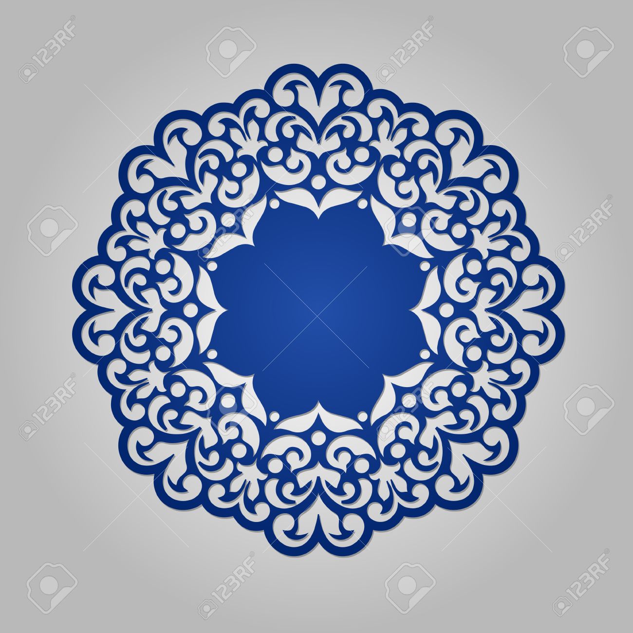 die cut paper card with cutout mandala ornament may be used