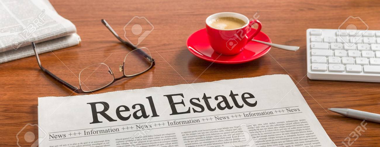 A newspaper on a wooden desk - Real Estate - 59198351 A newspaper on a wooden desk - Real Estate - 59198351
