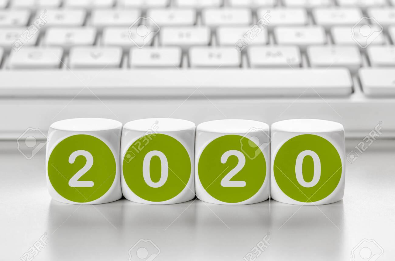 Letter dice in front of a keyboard - 2020 - 134566590 Letter dice in front of a keyboard - 2020 - 134566590