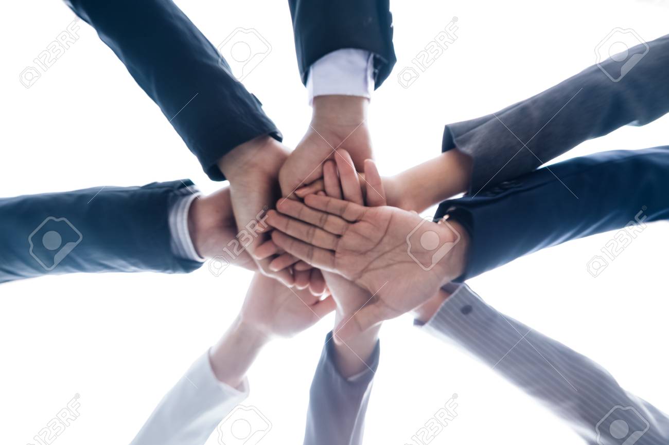 closeup business teamwork bottom view of join hands put together