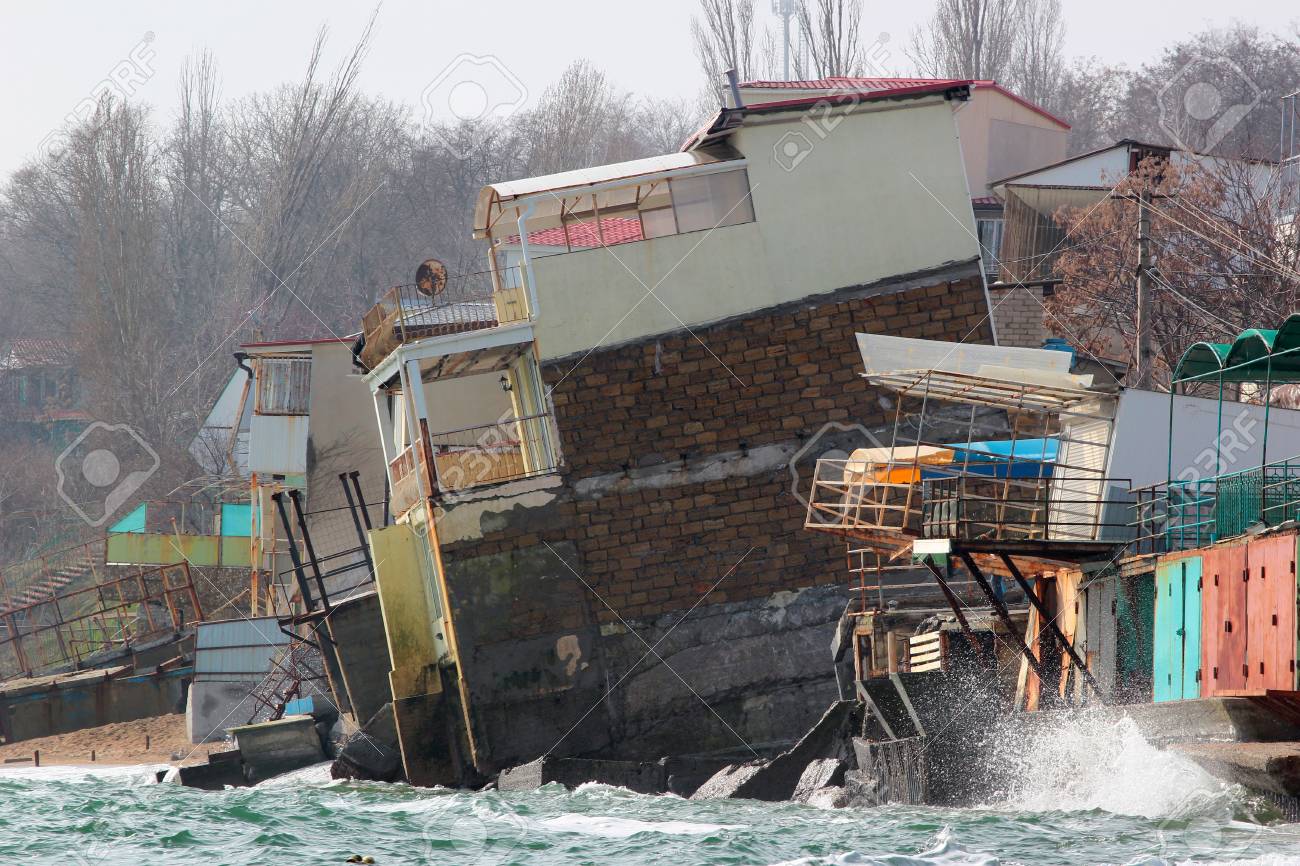 Coastal erosion - houses built on weak clay soil slide down to the sea and collapse near Odessa, Ukraine - 109820521 Coastal erosion - houses built on weak clay soil slide down to the sea and collapse near Odessa, Ukraine - 109820521