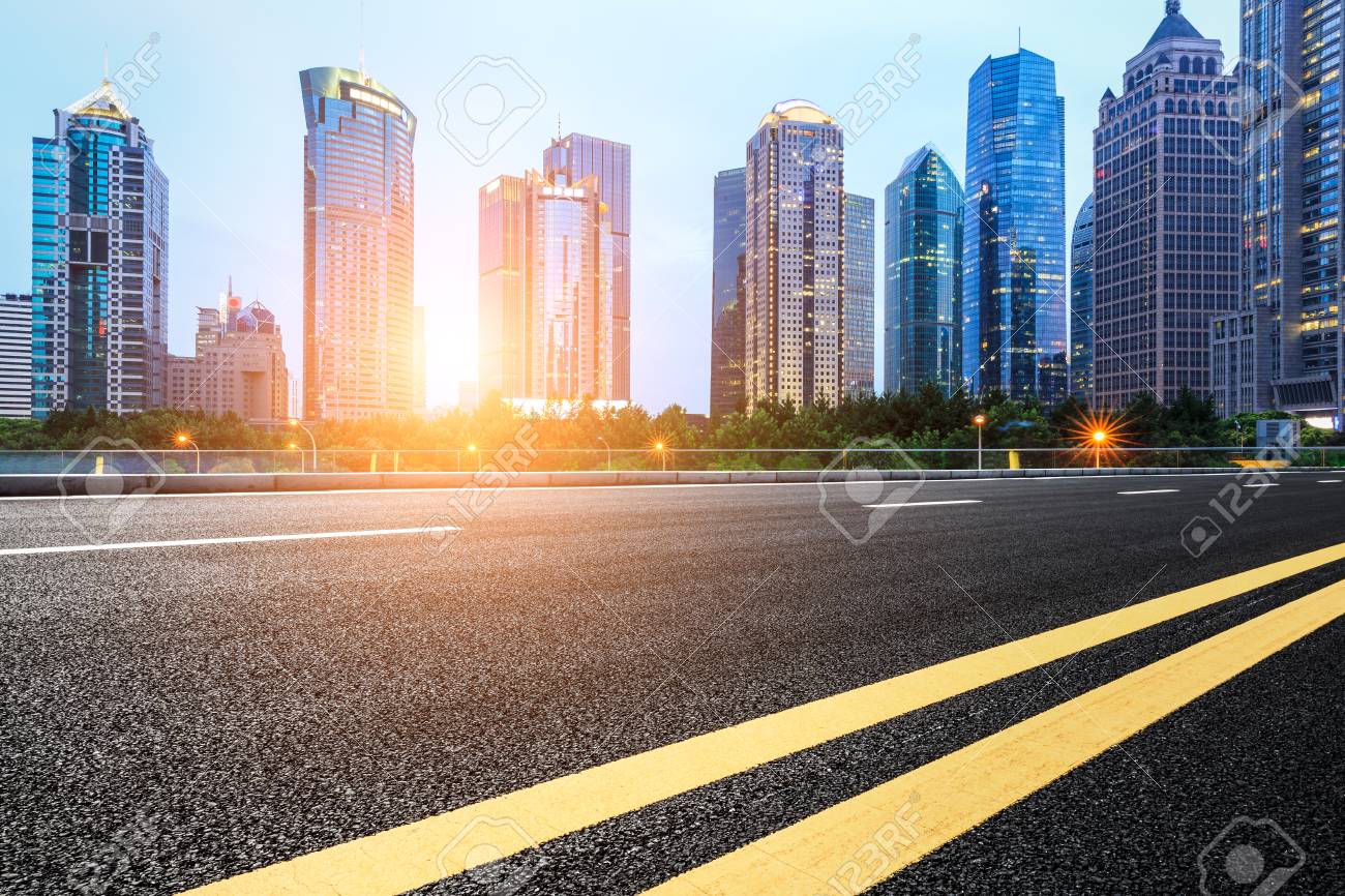 asphalt road and modern buildings in shanghai china stock photo