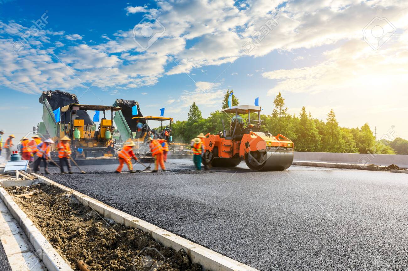 Construction Site Is Laying New Asphalt Road Pavement,road Construction  Workers And Road Construction Machinery Scene. Stock Photo, Picture And  Royalty Free Image. Image 137225423.