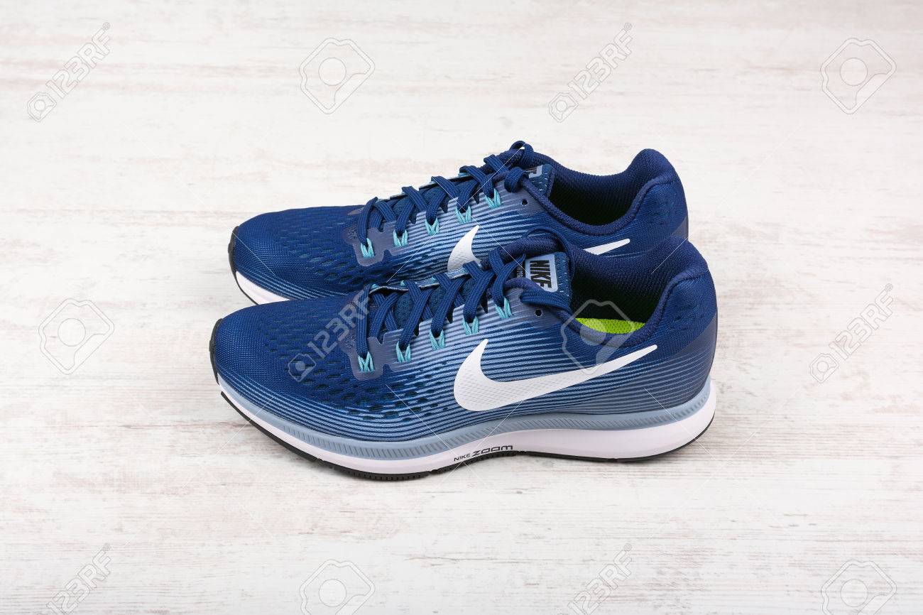 Burgas Bulgaria September 6 17 Nike Air Zoom Pegasus 34 Women S Running Shoes In Blue On White Wooden Background Nike Is A Global Sports Clothes And Running Shoes Retailer Stock Photo