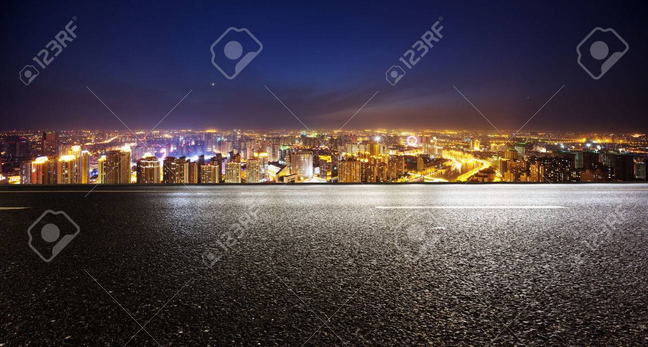 Empty asphalt road and modern skyline at night - 41369822 Empty asphalt road and modern skyline at night - 41369822
