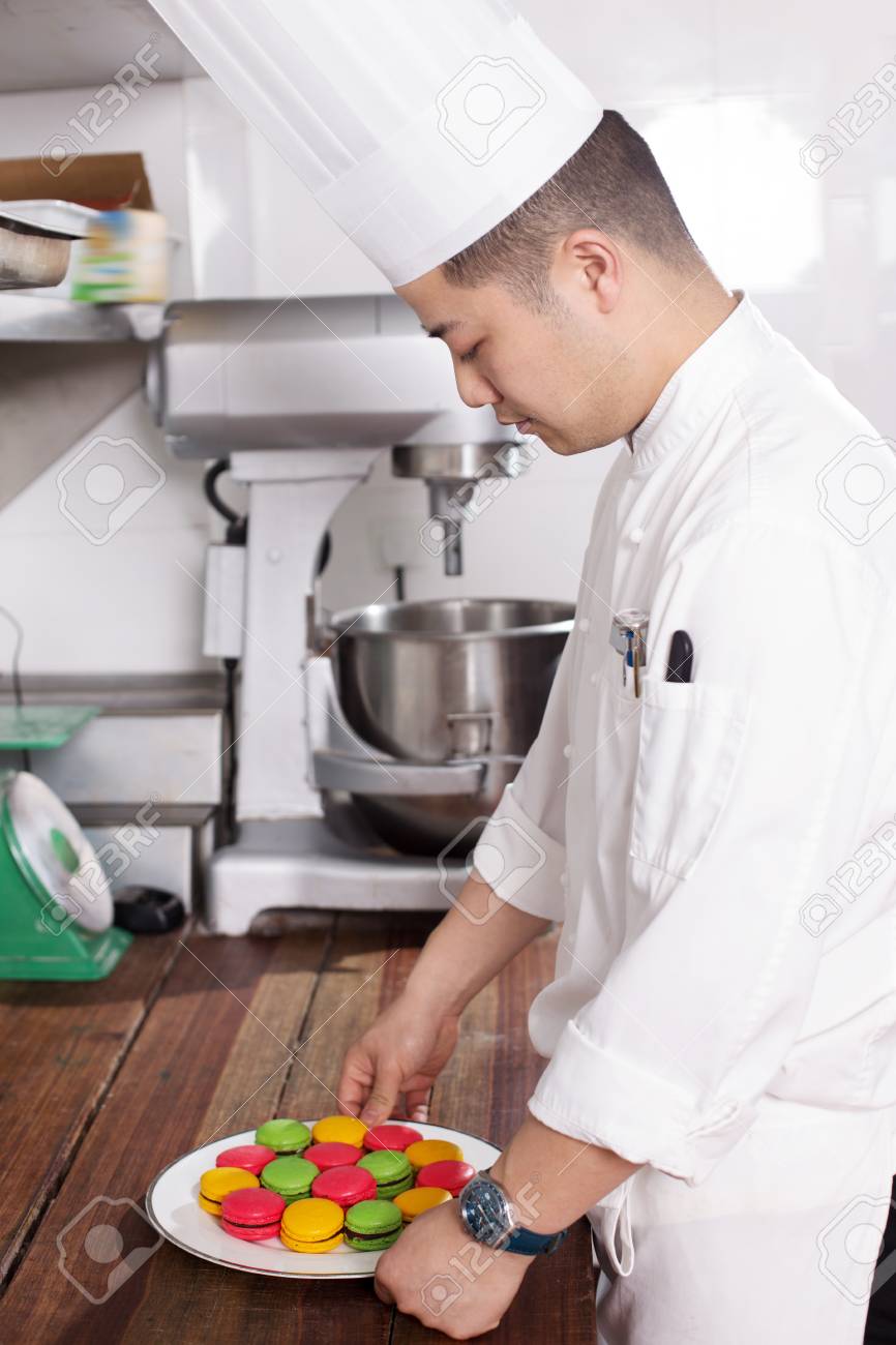 Young Chinese Man Chef Making Food In Modern Kitchen Stock Photo Picture And Royalty Free Image Image