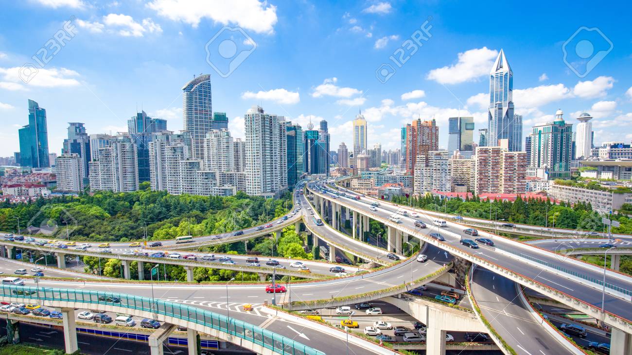 road junction and modern buildings in shanghai in blue cloud sky from high angle view - 93069646 road junction and modern buildings in shanghai in blue cloud sky from high angle view - 93069646