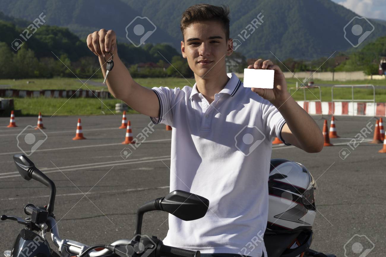 Teen Driving Course >> Teen On The Scooter Is Showing Driving License And Motorcycle Teen Driving Course >> Teen On The Scooter Is Showing Driving License And Motorcycle