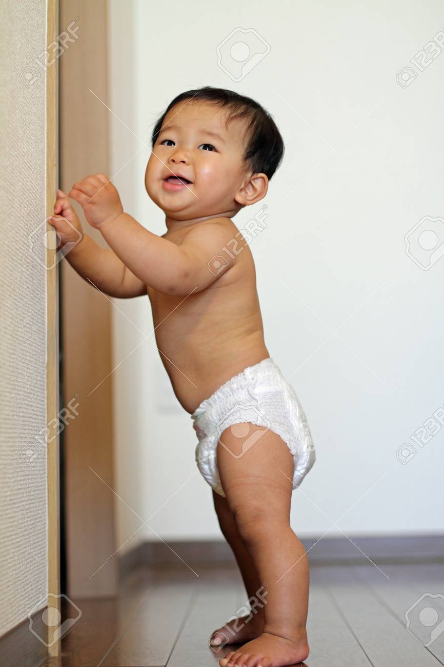 Baby Boy Pulling Up To Stand Stock Photo Picture And Royalty Free Image Image