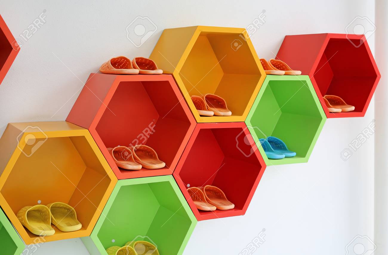Colorful Modern Shoe Rack On The White Wall Stock Photo Picture
