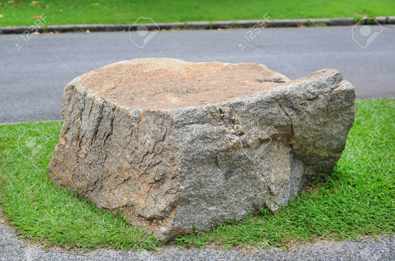 113386501-rock-seat-in-park-natural-ston