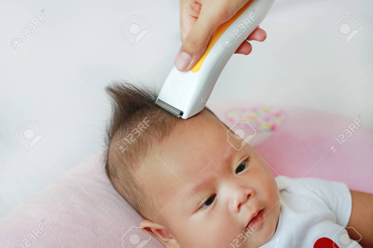 Closeup Asian Infant Baby Boy Getting A Haircut