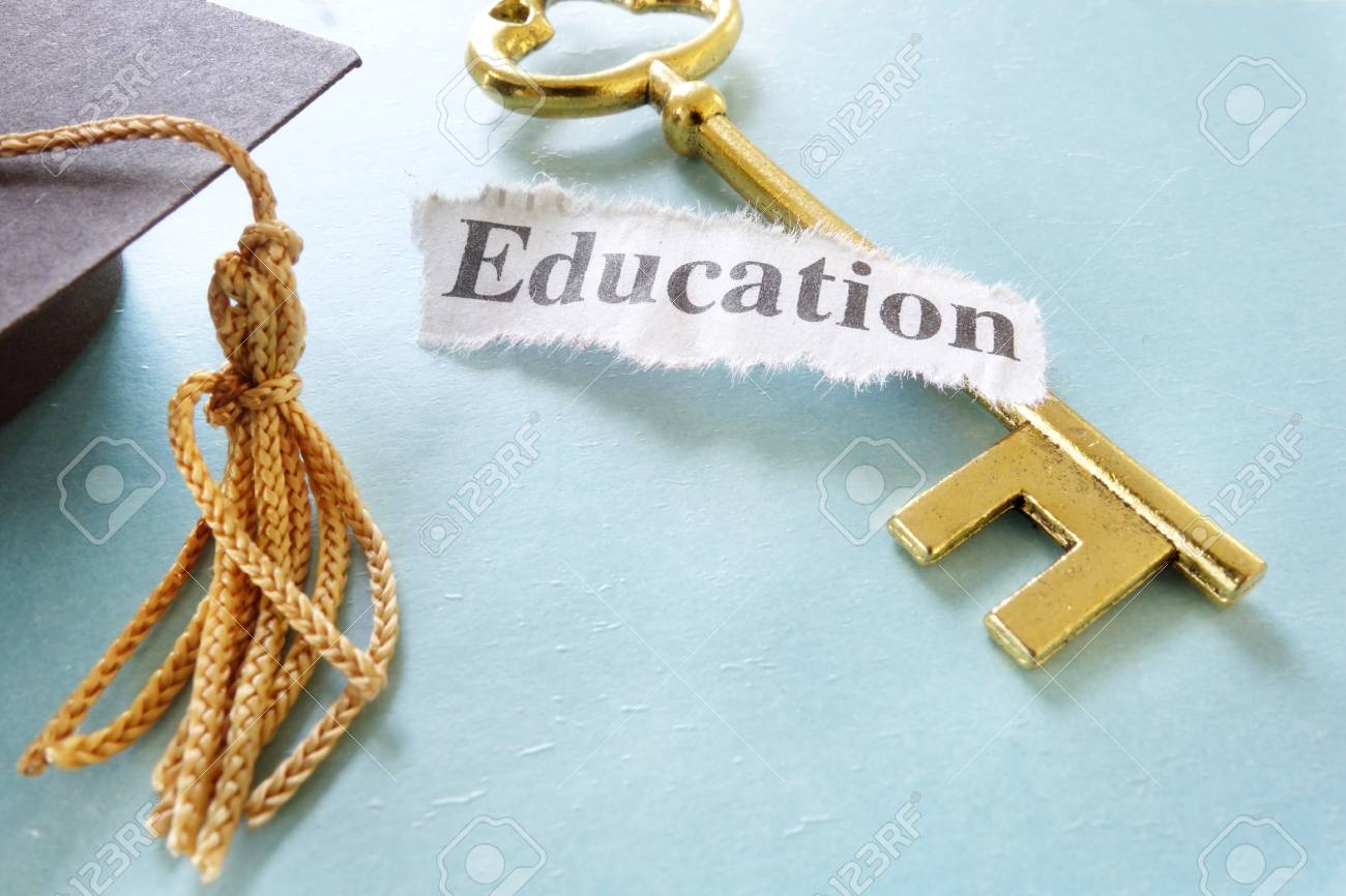 Education note on a golden key, with graduation cap - 23994974 Education note on a golden key, with graduation cap - 23994974