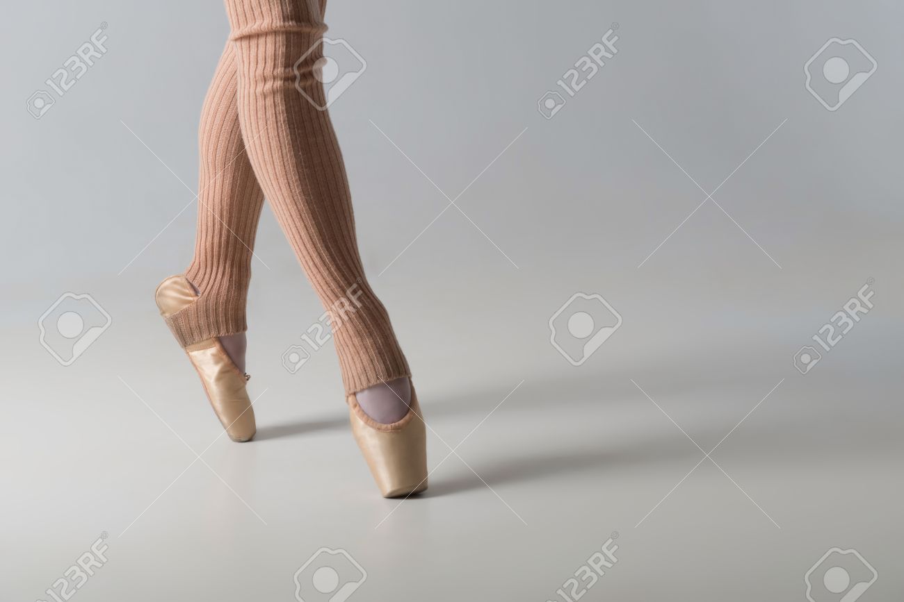 Closeup Portrait Of A Dancer Legs In Ballet Shoes And Long Socks