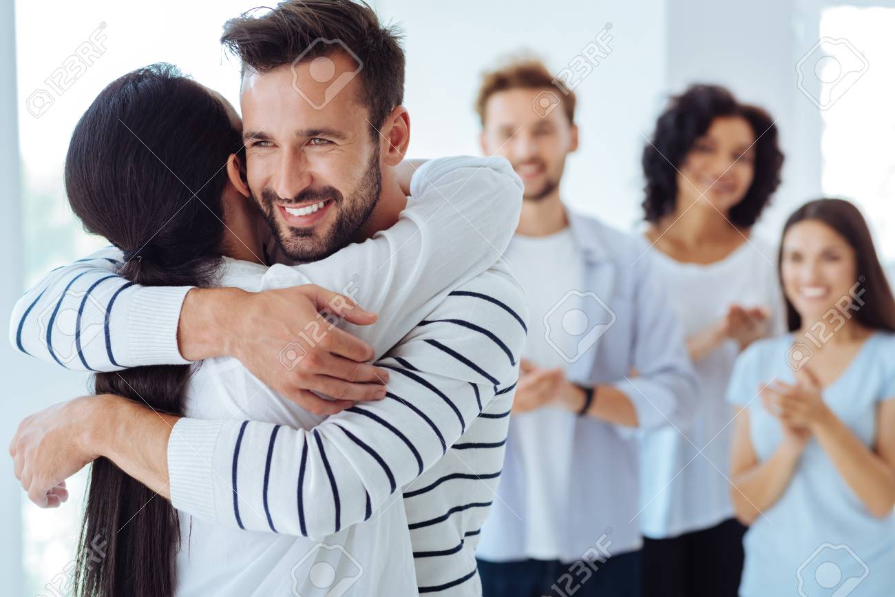 Positive Happy People Hugging Each Other Stock Photo, Picture and Royalty  Free Image. Image 85413425.