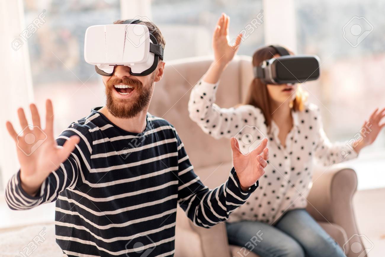 Virtual Journey Gay Appealing Vigorous Man Laughing While Resting And Wearing Vr Headset Stock Photo Picture And Royalty Free Image Image