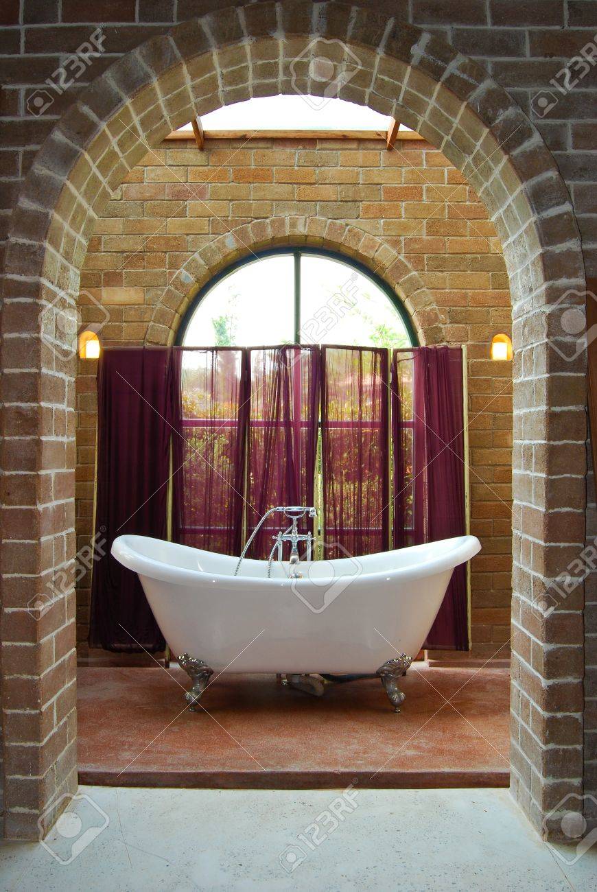 interior of vintage bathroom with bathtub in brick wall decoration interior of vintage bathroom with bathtub in brick wall decoration