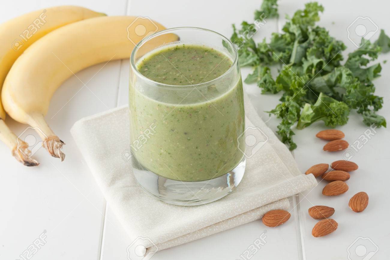 green smoothie on white background, ingredients include bananas, fresh kale and almonds - 38498378 green smoothie on white background, ingredients include bananas, fresh kale and almonds - 38498378