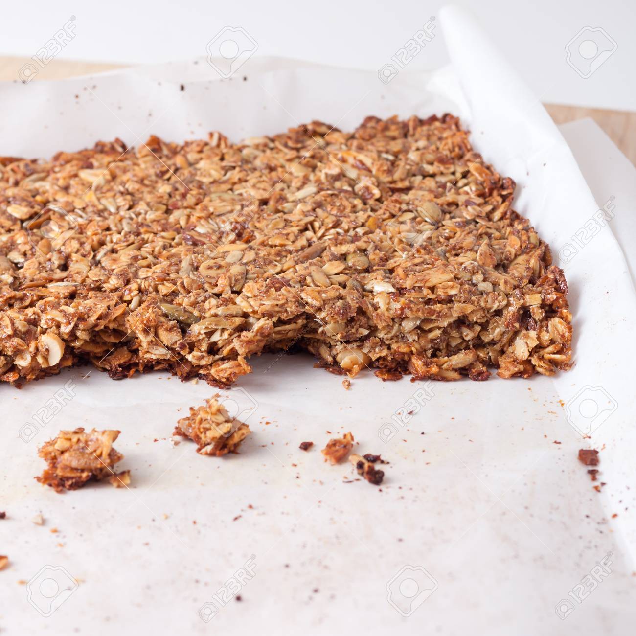 fresh home made granola bars made with coconut oil, nuts and seeds on a baking sheet, isolated - 44167900 fresh home made granola bars made with coconut oil, nuts and seeds on a baking sheet, isolated - 44167900