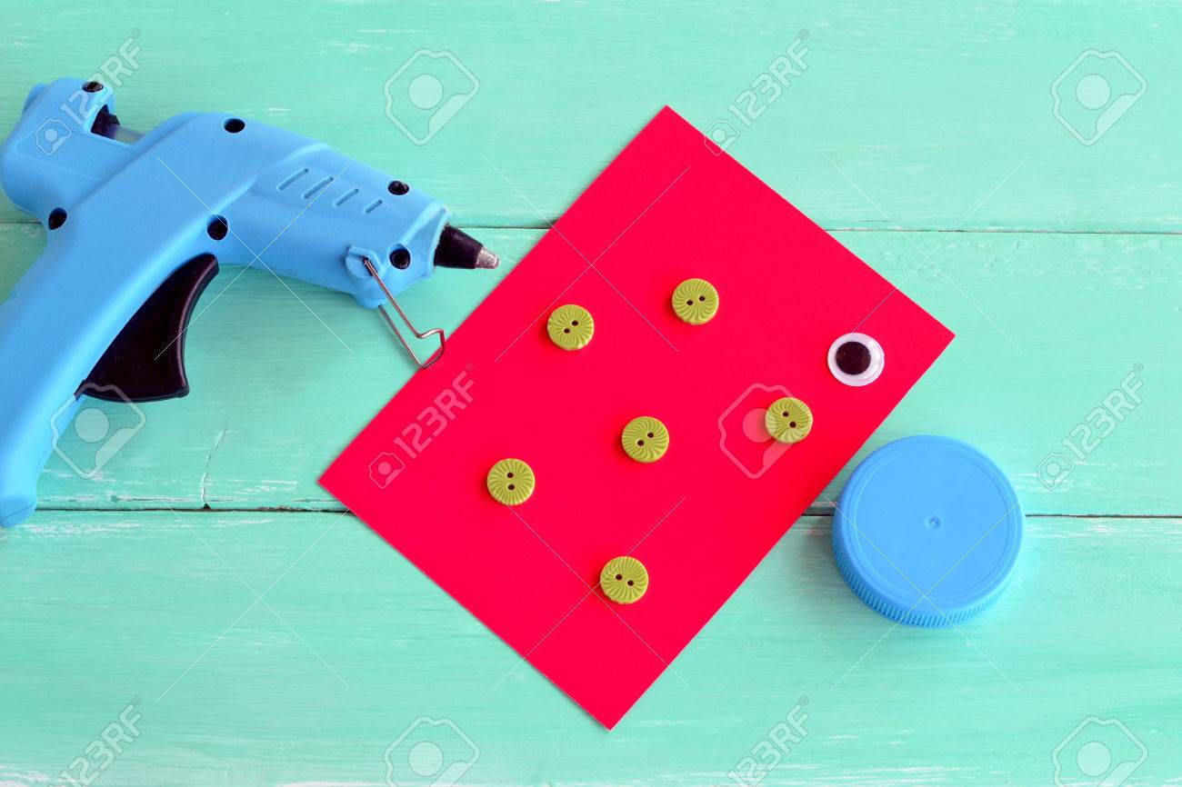 Project To Make From Recycling Bottle Caps Kids Art Hot Glue Gun A Cap Plastic Buttons Cardboard Sheet Project To Make From Recycling Bottle Caps Kids Art Hot Glue Gun A Cap Plastic Buttons Cardboard Sheet