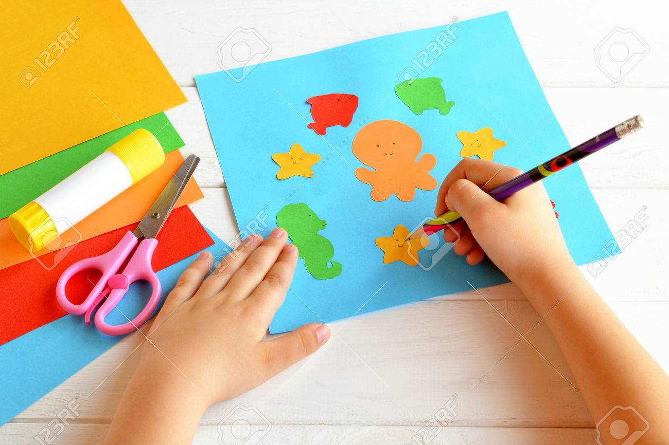 Child Keeps A Pencil In Hand And Draws Scissors Glue Stick Colorful Paper Child Keeps A Pencil In Hand And Draws Scissors Glue Stick Colorful Paper