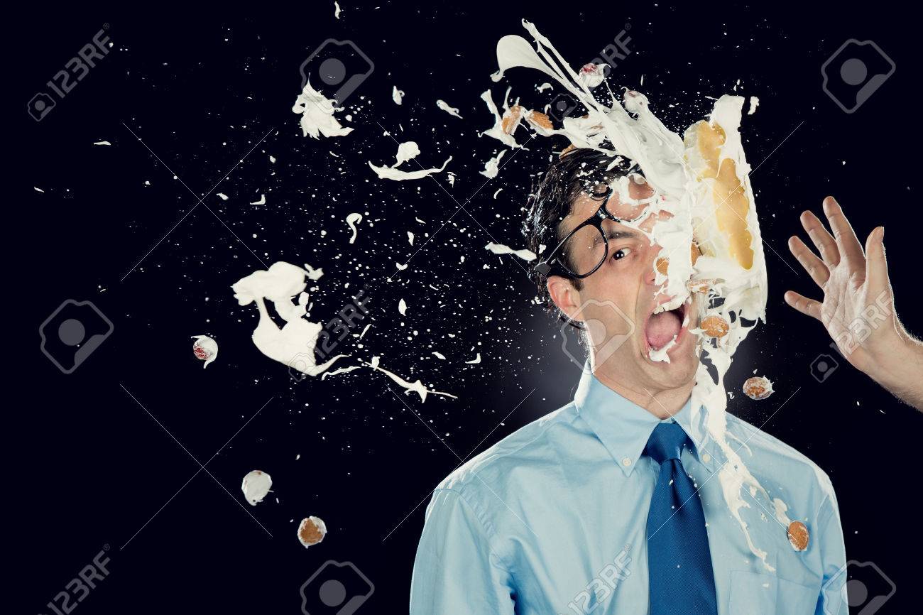 Ballot D Affaires Avec Un Gateau Sur Le Visage Isole Sur Noir Banque D Images Et Photos Libres De Droits Image