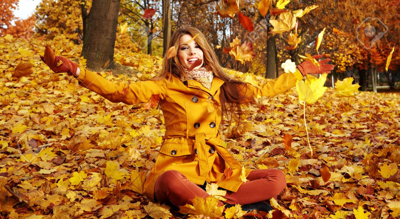 Portrait Of An Autumn Woman Lying Over Leaves And Smiling Stock Photo, Picture And Royalty Free Image. Image 11148484.