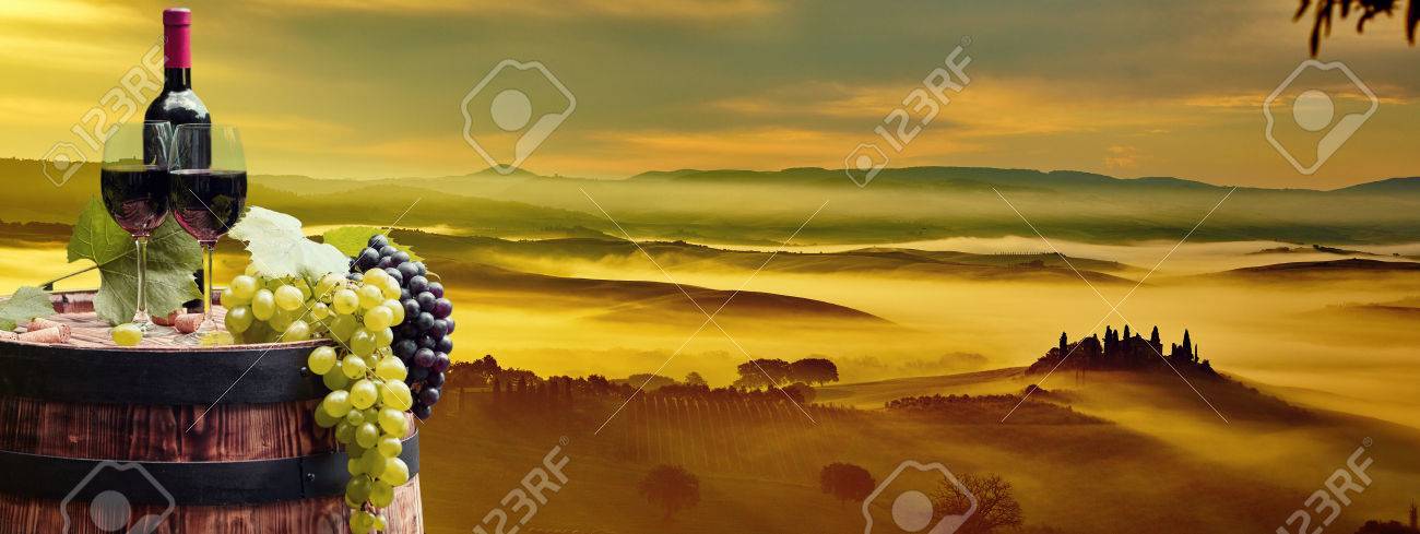 Red wine bottle and wine glass on wodden barrel. Beautiful Tuscany background - 46624100 Red wine bottle and wine glass on wodden barrel. Beautiful Tuscany background - 46624100