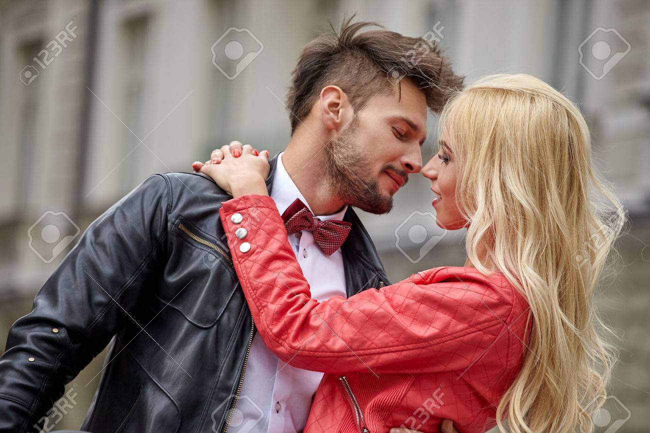 Young funny pretty fashion vintage hipster couple having fun outdoor on the street in summer. - 50763126 Young funny pretty fashion vintage hipster couple having fun outdoor on the street in summer. - 50763126