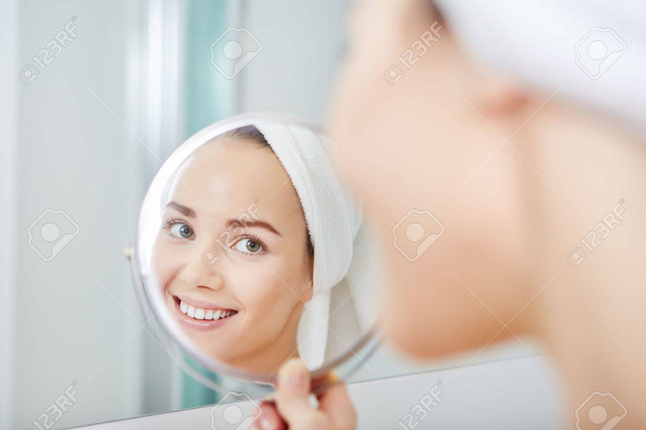 face of young beautiful healthy woman and reflection in the mirror - 51686371 face of young beautiful healthy woman and reflection in the mirror - 51686371