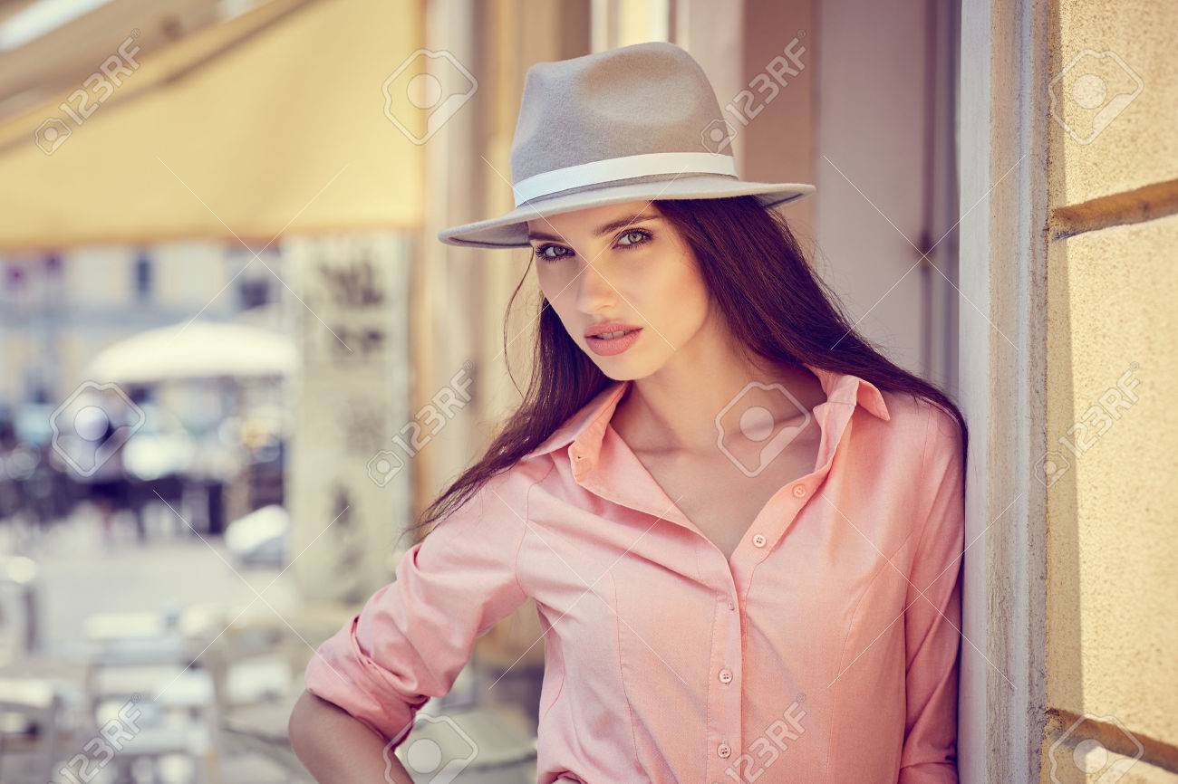 Beautiful young woman walking in the city. Fashion. - 70974214 Beautiful young woman walking in the city. Fashion. - 70974214