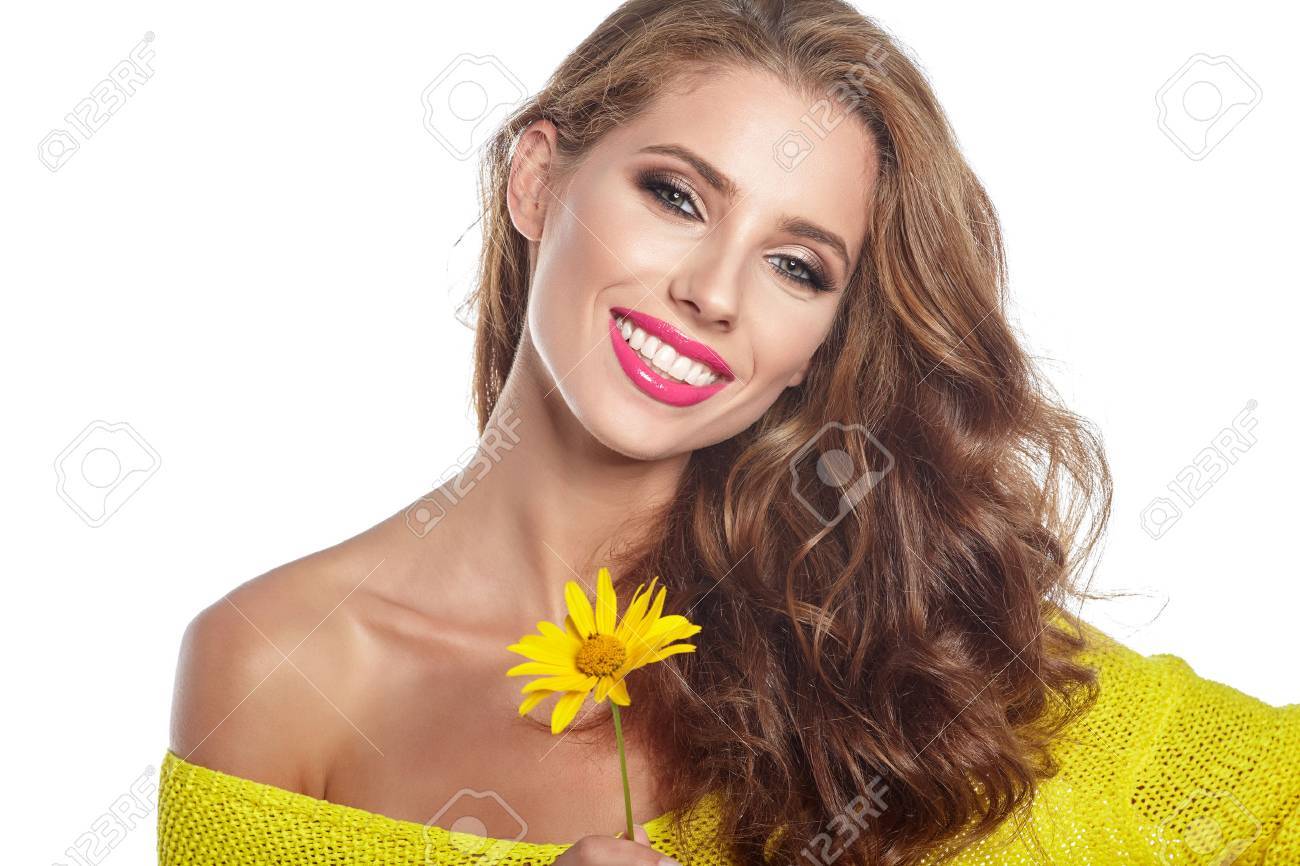 Portrait of young beautiful woman with stylish make-up and sunflower - 71186989 Portrait of young beautiful woman with stylish make-up and sunflower - 71186989