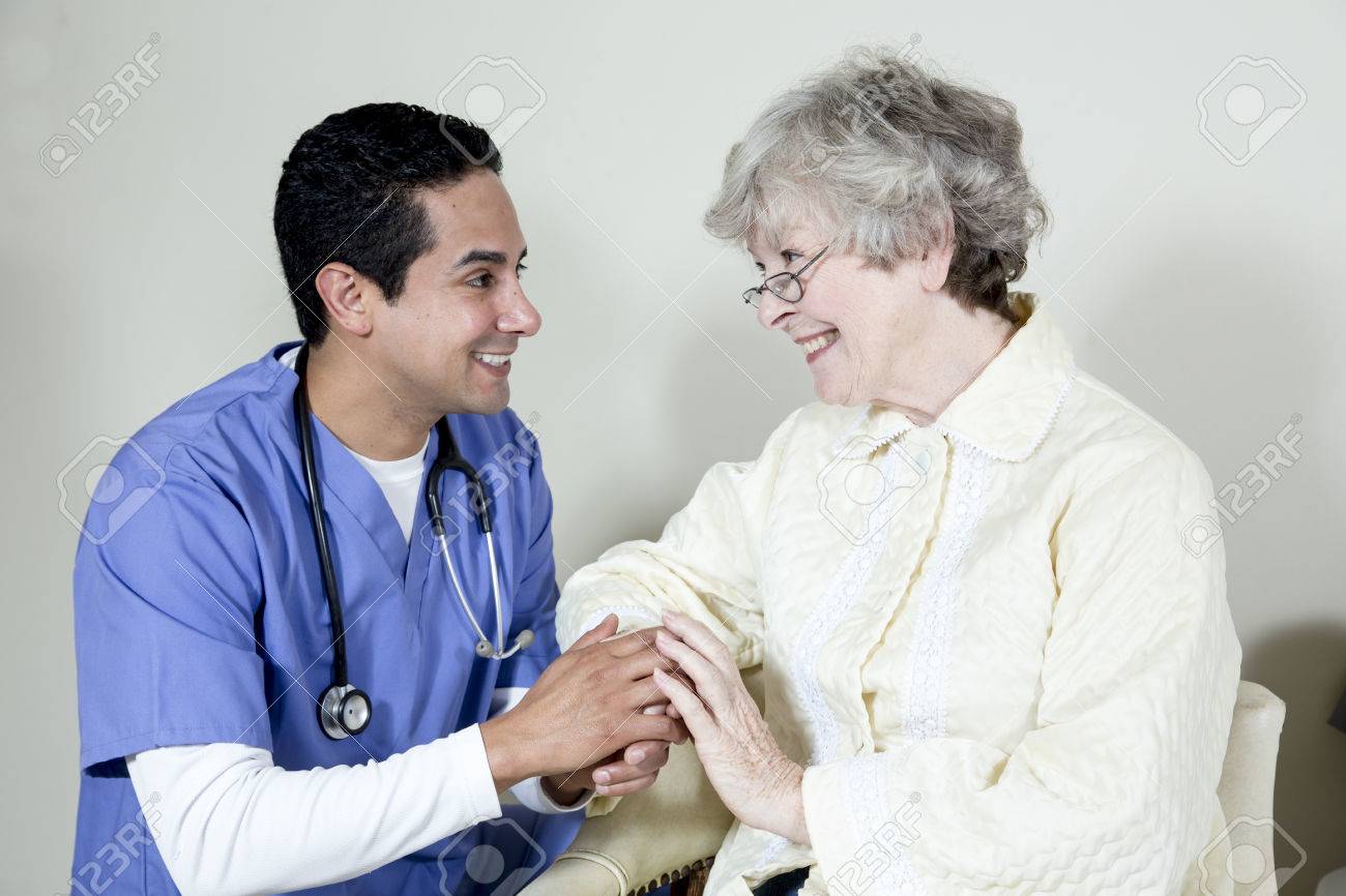 Male Nurse Assisting Elderly Patient Stock Photo Picture And