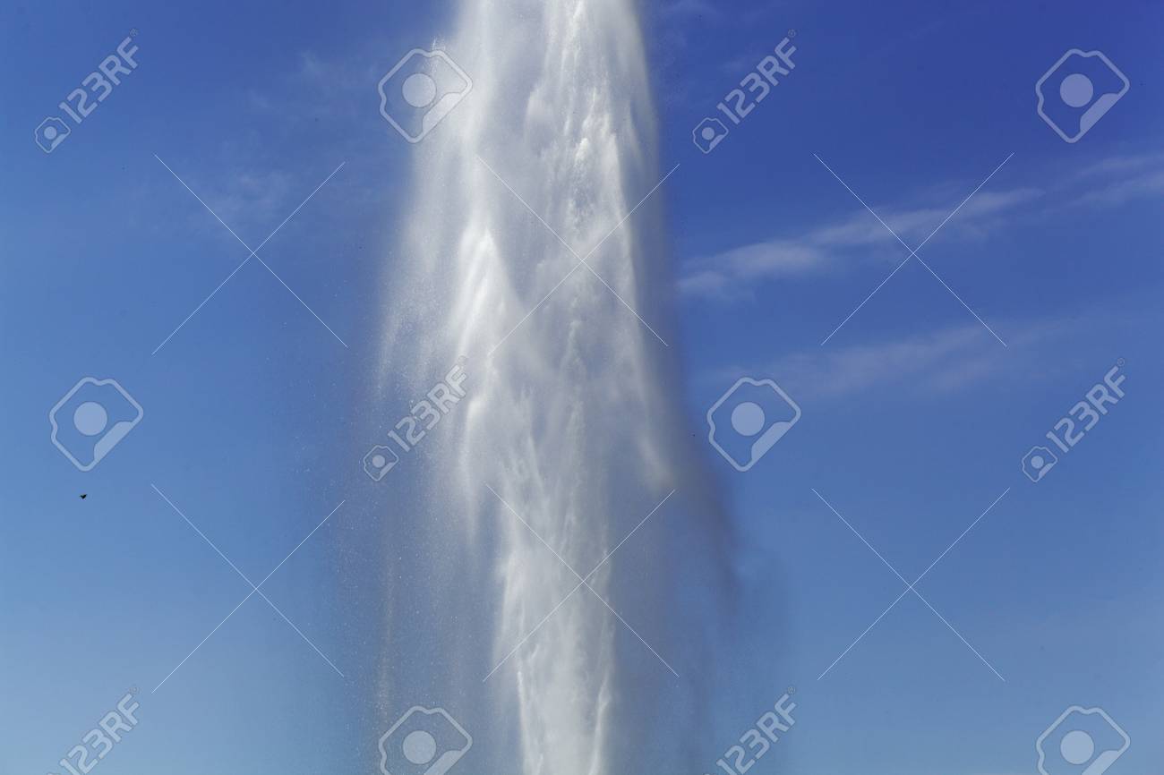A Water Fountain With A Blue Sky Stock Photo Picture And Royalty Free Image Image