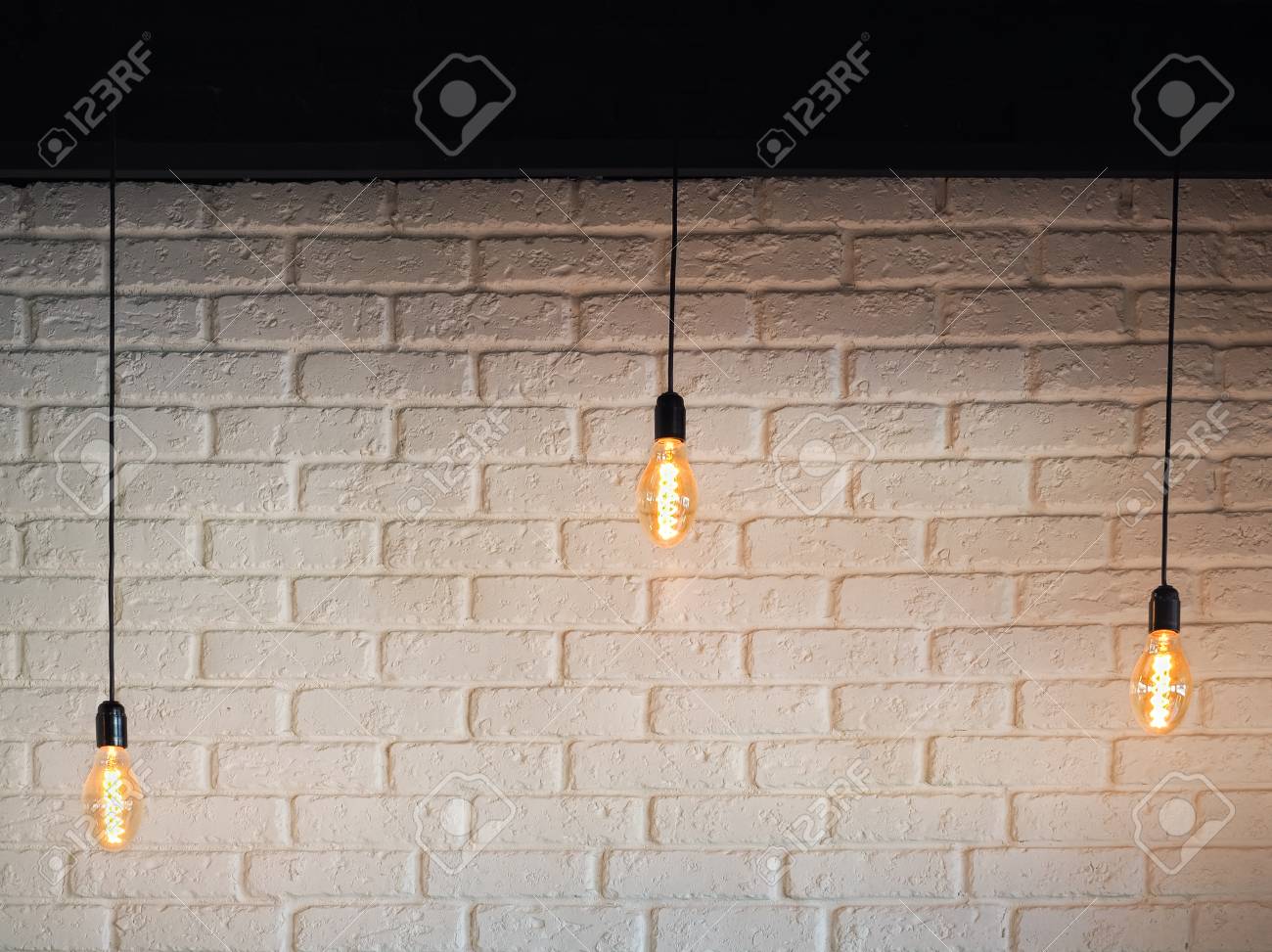 Old Lighting Electric Bulb Retro Lamp On A Background Of A White