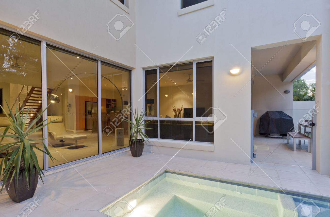 Modern House With Living Room Overlooking The Pool And Backyard ... Modern House With Living Room Overlooking The Pool And Backyard ...