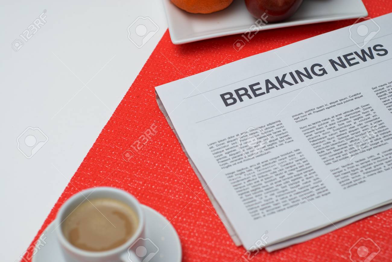 Breaking News Article In The Newspaper At Home Stock Photo Breaking News Article In The Newspaper At Home Stock Photo