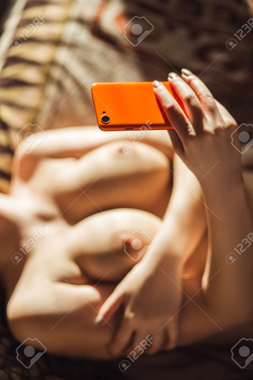 Breasts selfie Busty Girl Makes A Selfie Of Their Breasts While Lying On The Sofa In  Sunlight. Stock Photo, Picture and Royalty Free Image. Image 55067258.