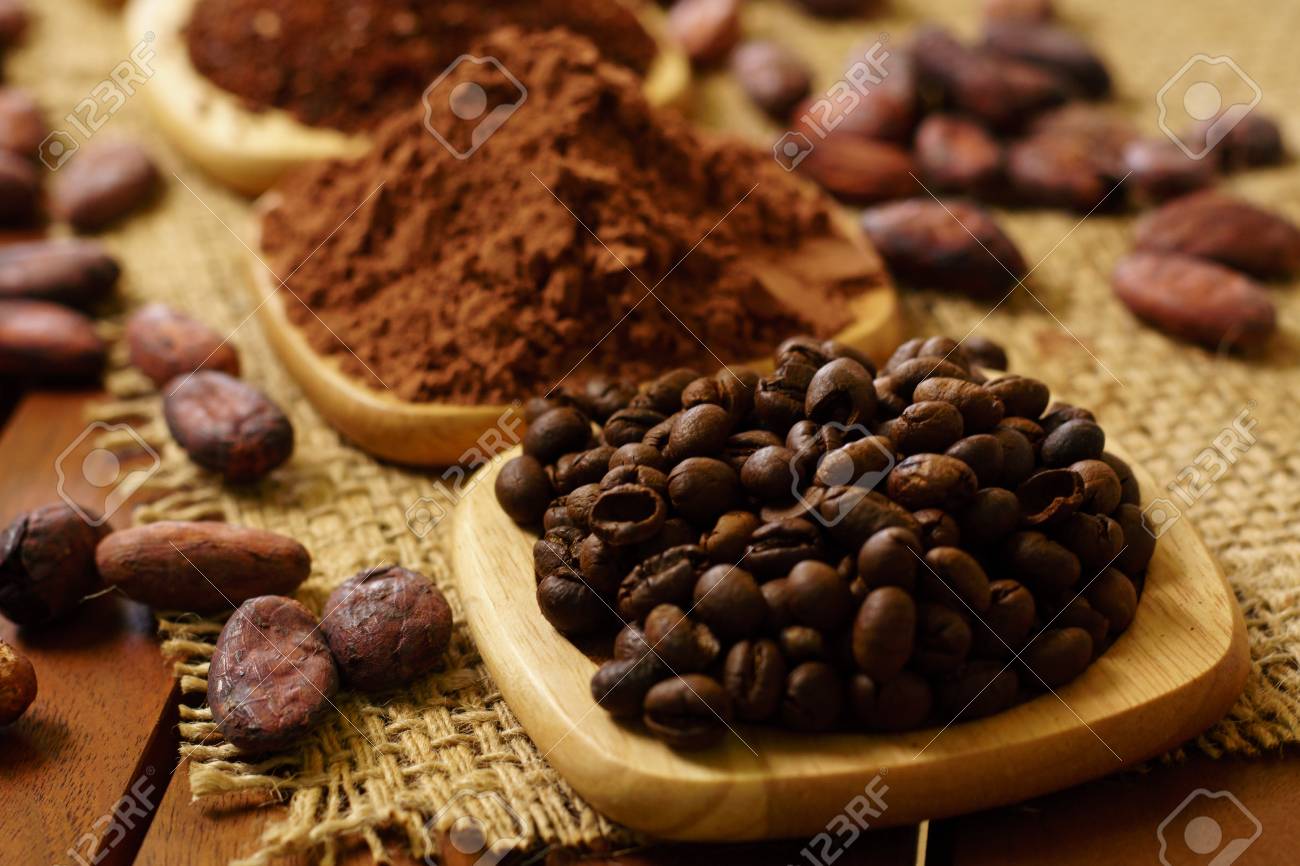 Coffee Beans, Cacao Powder, Cocoa Nibs, On Wooden Plates On Burlap ... Coffee Beans, Cacao Powder, Cocoa Nibs, On Wooden Plates On Burlap ...