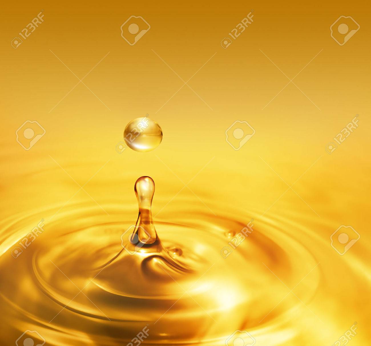 bright dripping oil close up as background - 47319957 bright dripping oil close up as background - 47319957