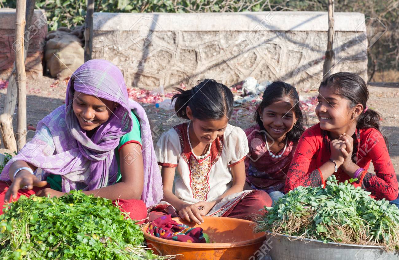 MAHARASHTRA, INDIA - JANUARY 10, 2016: Indian Girls Selling Vegetables.. Stock Photo, Picture And Royalty Free Image. Image 101239626.